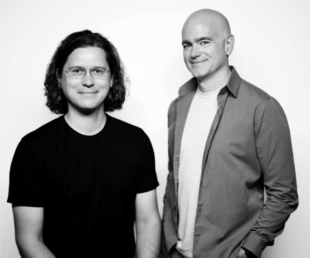 Sasha Sinkevich and Jon McLachlan, co-founders of YSecurity and Ceed, in a black and white studio portrait.